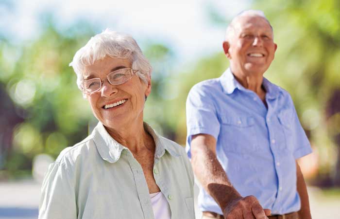 Older couple smiling outside, implants in Pryor, OK